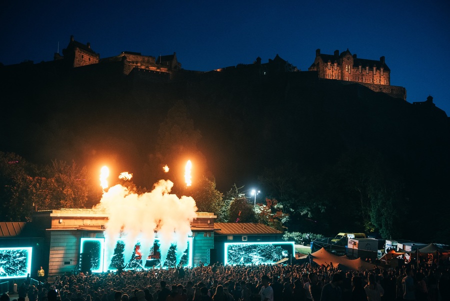 A photo of the stage at FLY Open Air Festival, with Edinburgh Castle visible in the background.