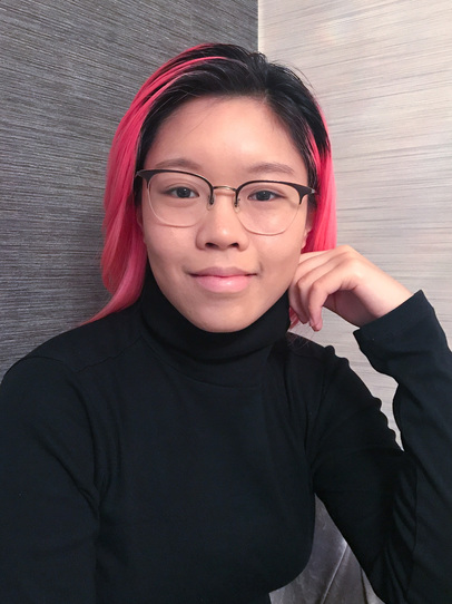 Portrait photo of Karlie Wu; Karlie wears glasses and a black turtleneck jumper, against a grey background