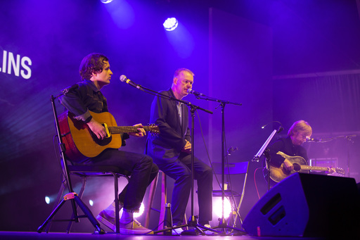 Edwyn Collins and two members of his band on stage at Edinburgh International Festival.