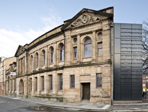 Exterior view of Glasgow Women's Library; a large Victorian-era building with a large metallic addition to the facade.