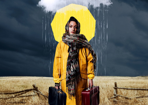 A woman in a yellow anorak holds two suitcases beneath a rain cloud. A yellow hexagon is visible in the background.