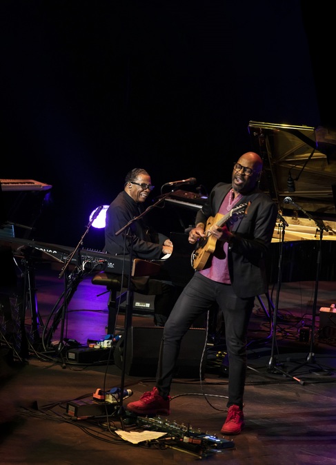 Herbie Hancock plays the piano while Lionel Loueke plays his guitar, in a photo taken at Edinburgh International Festival
