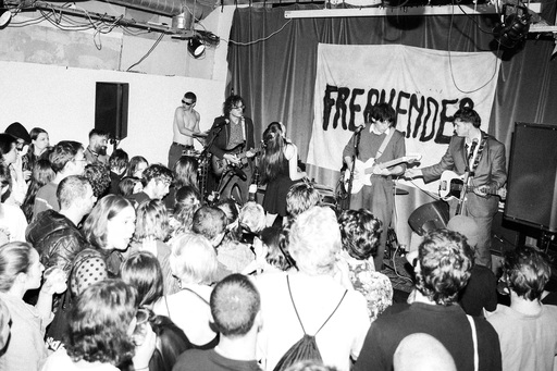 Kaputt on stage at Freakender. A large crowd stands in front of the stage.