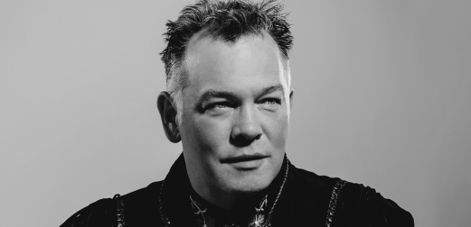 Black-and-white portrait photo of Stewart Lee.