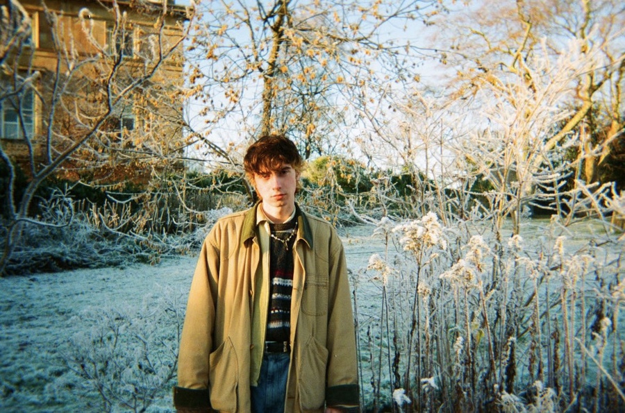 Carsick Charlie, standing in front of a snow-covered tree