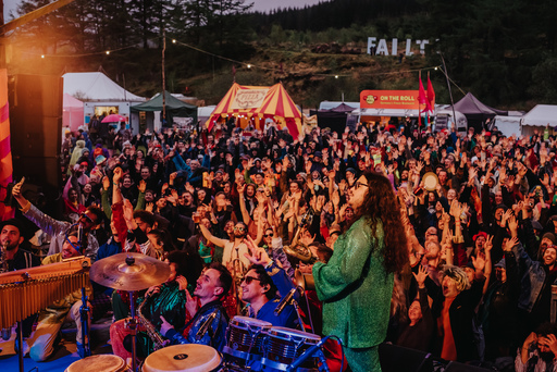 Newen Afrobeat on stage at Knockengorroch. Photo taken from the back of the stage, so a large crowd is visible.