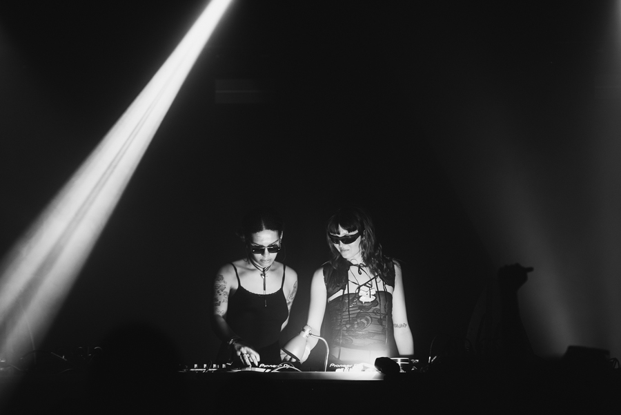 A black and white photo of TAAHLIAH on stage at Terminal V.