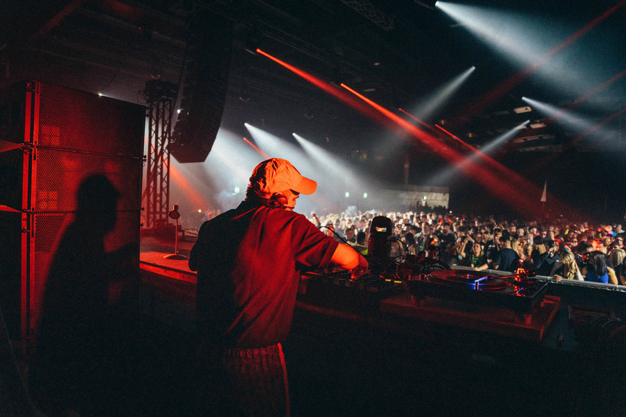 Hector Oaks on stage at Terminal V. The crowd are visible in the distance.