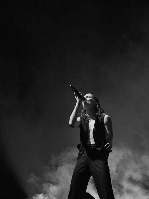 A black and white photo of Christine and the Queens on stage at Usher Hall.