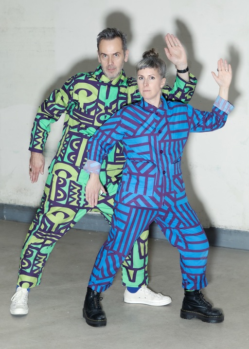 Mil Stricevic + Jolene Crawford pose in their patterned pyjamas.