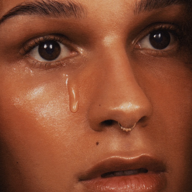 Album artwork for Gramarye by TAAHLIAH. A close-up photo of a woman's face, with a single tear dripping from the right eye.