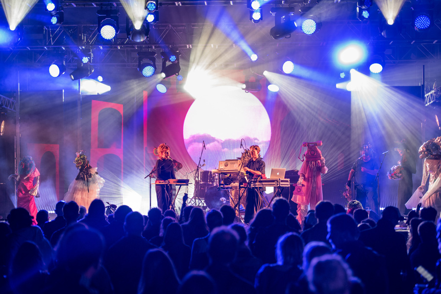 Photo of Maranta performing on stage, with a crowd visible in front of them.