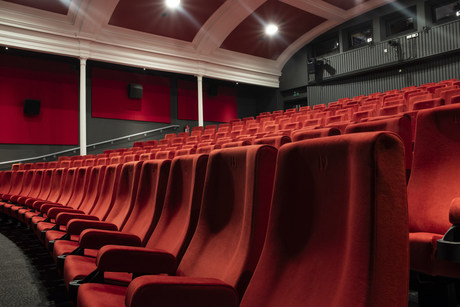 Photo of rows of red seats in a screening room at the Filmhouse cinema in Edinburgh.