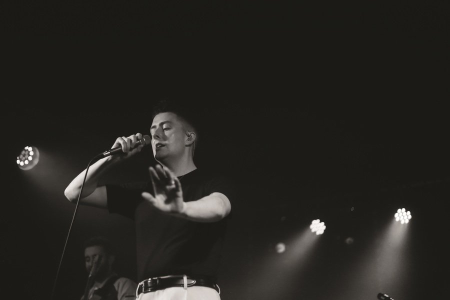 A black and white photo of Joesef on stage.
