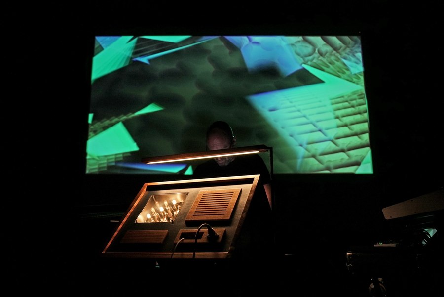 Photo of Lomond Campbell performing with his muonophone instrument.