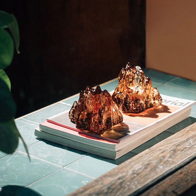 Photo of two Kosta Boda votive candle holders.