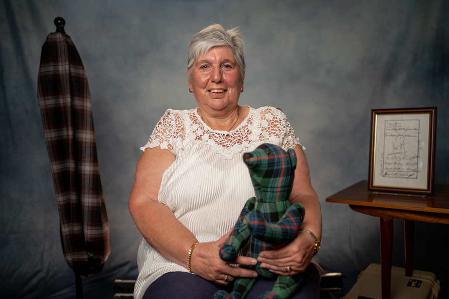 A still from Neil Armstrong and the Langholmites; an image of a woman holding a tartan teddy bear
